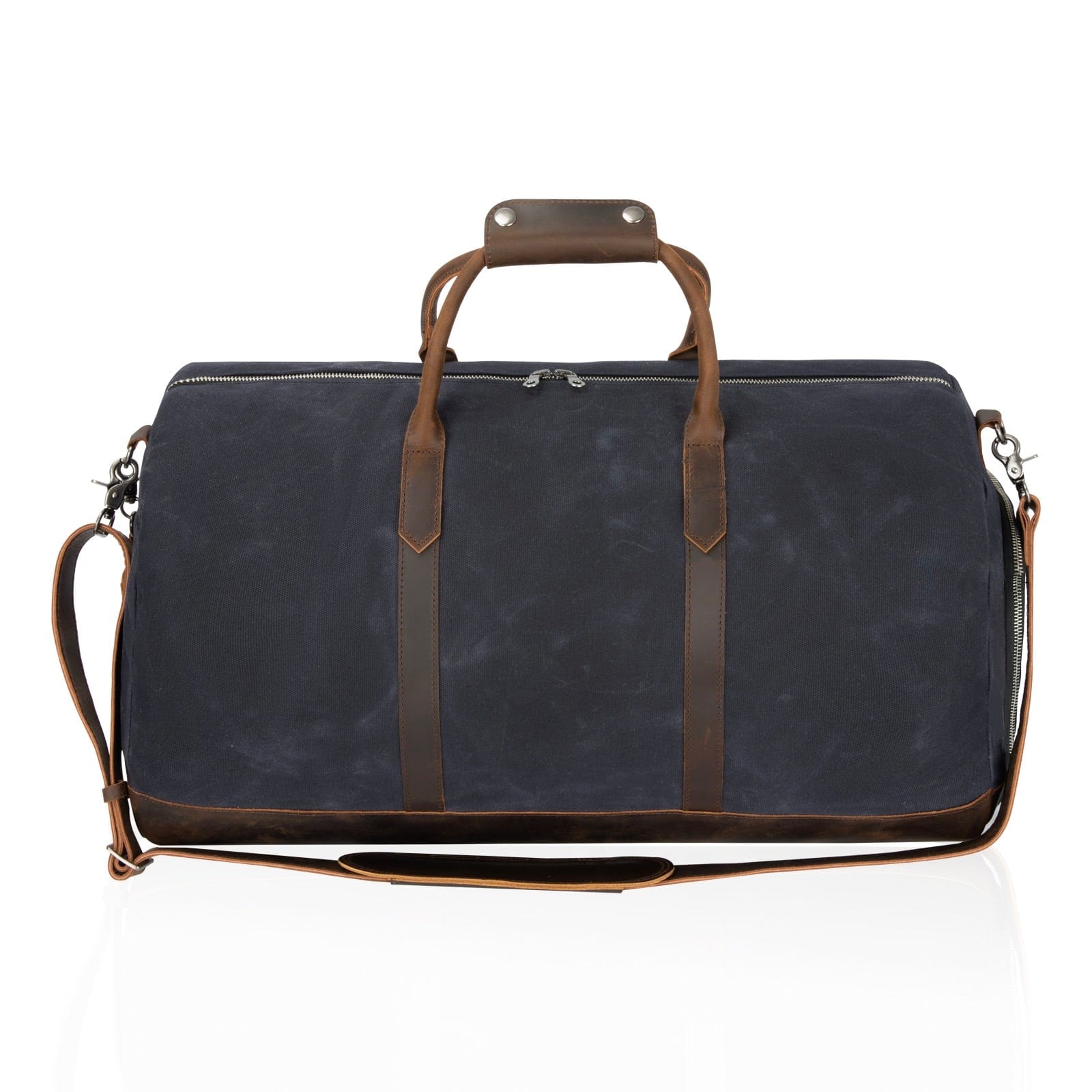Navy canvas travel bag with brown leather handles and top zipper